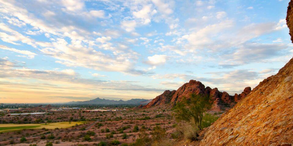 The Papago mountains show red under a beautiful blue sky in Phoenix, Arizona.