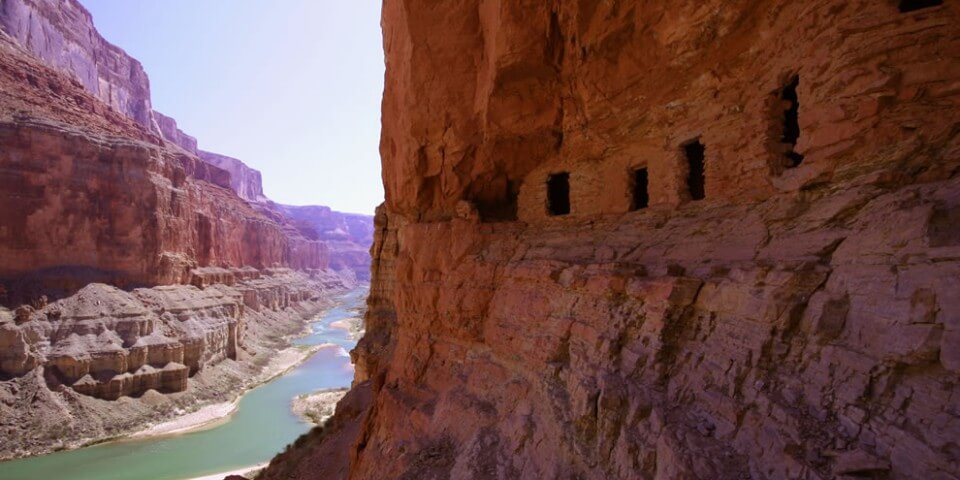 Pueblo native ruins along the side of a Grand Canyon cliff. 