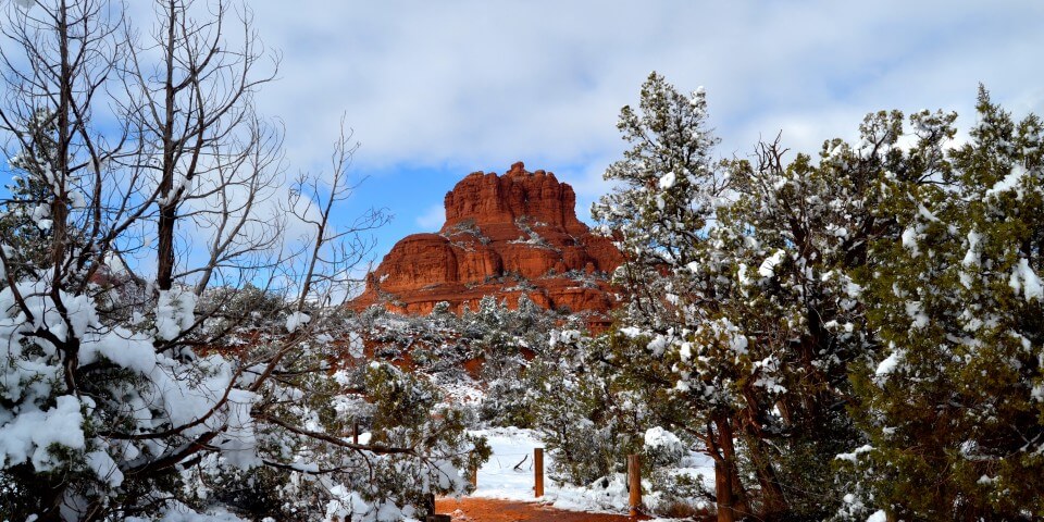 The red rocks of Sedona, Arizona with snow in the foreground.