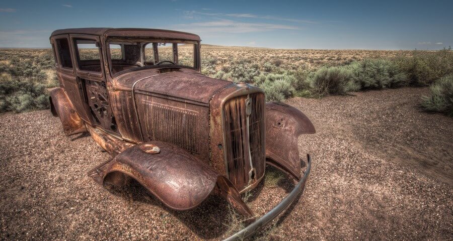 An old car is preserved in the Painted Desert.