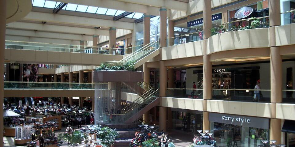 Interior shot of shoppers walking around the Scottsdale Fashion Square mall.