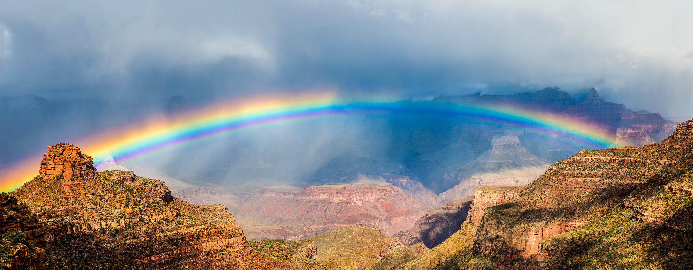 Rainbow across and above the Grand Canyon.