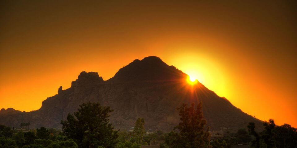 Phoenix's Camelback Mountain silhouetted during sunset.