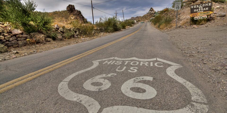 Route 66 shield stenciled on the road.