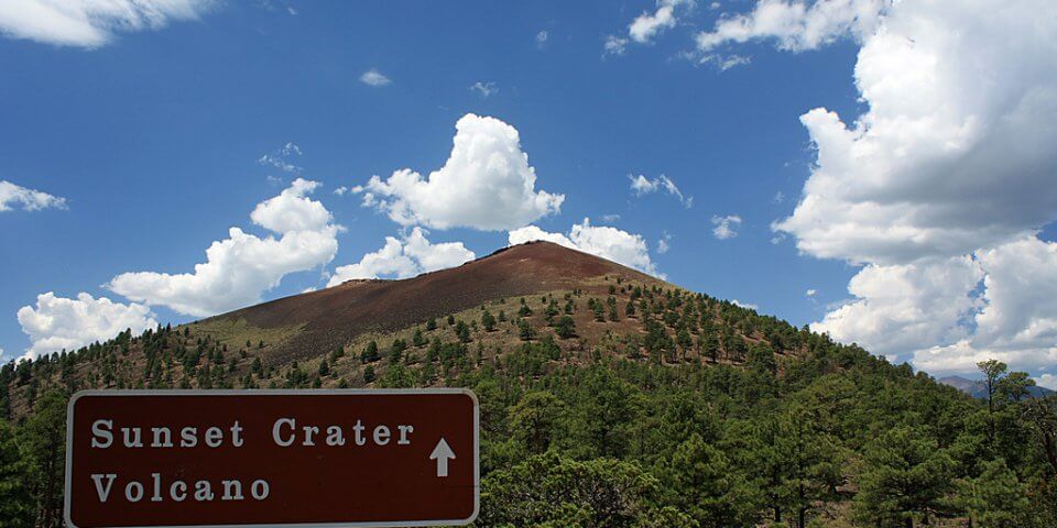Sunset Crater's sign in front of the volcano.

Flickr User tviv