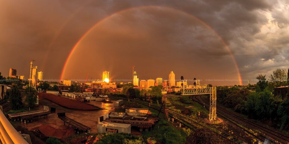 Raleigh, North Carolina framed by two rainbows.
