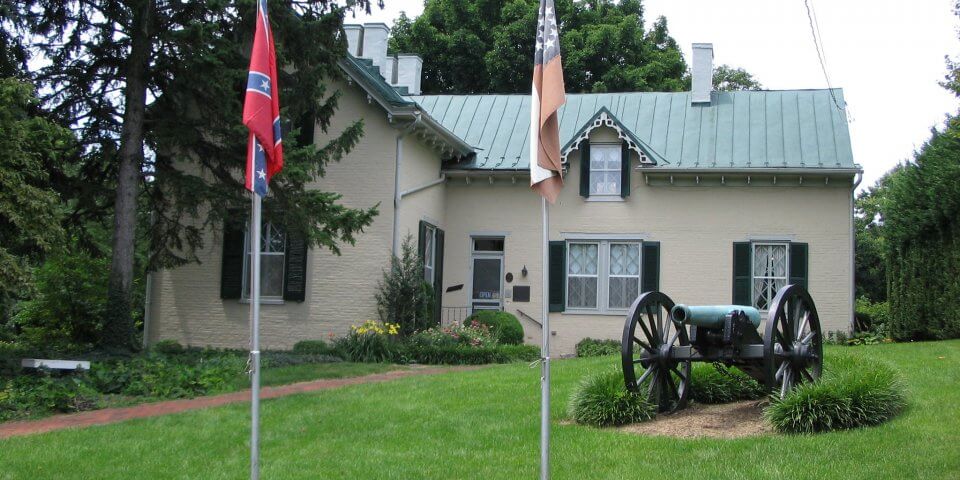 Exterior of Stonewall Jackson's Headquarters in Winchester, VA. A large cannon is out front.
