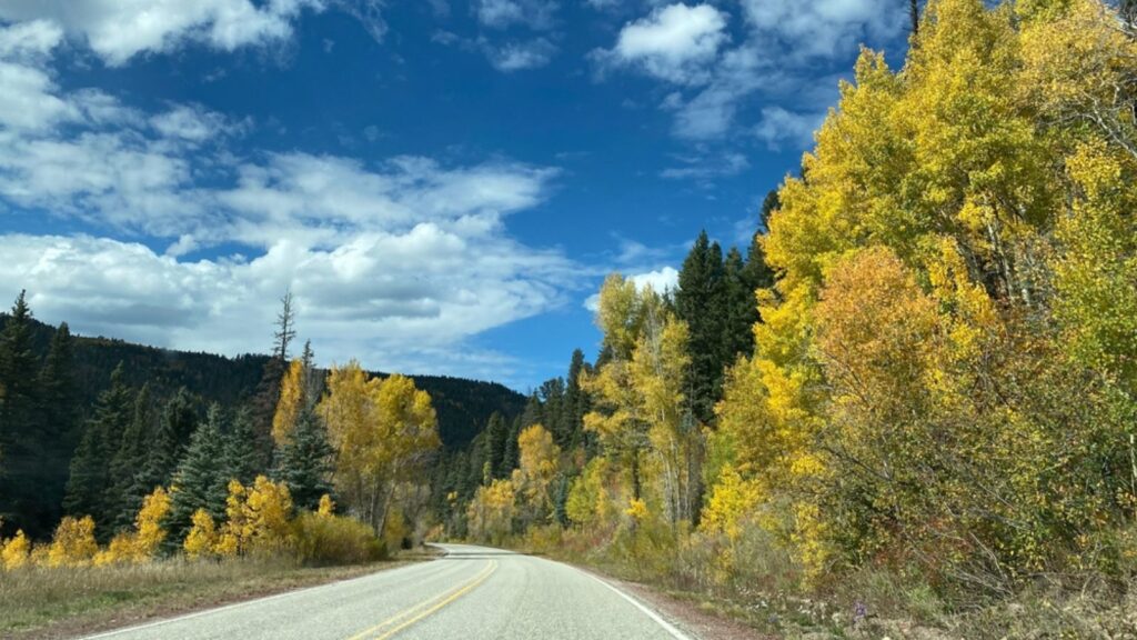 High Road to Taos Scenic Byway in New Mexico near Apache Canyon. Beautiful autumn colors, rugged terrain of the Sangre de Cristo Mountains, Carson National Forest. New Mexico highway 518.