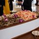 Shrimp and oysters served on ice in a wooden boat display